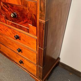 A Victorian Flamed Mahogany Lancashire chest of drawers with mother of pearl handles