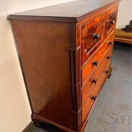 A Victorian Flamed Mahogany Lancashire chest of drawers with mother of pearl handles