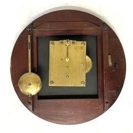 An immaculate large mahogany cased twin Fusee Striking wall clock housed in a mahogany case