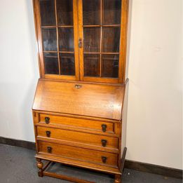 A Lovely Arts And Crafts Oak Bureau Bookcase with tooled leather writing area