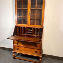 A Lovely Arts And Crafts Oak Bureau Bookcase with tooled leather writing area