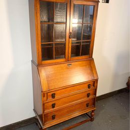 A Lovely Arts And Crafts Oak Bureau Bookcase with tooled leather writing area