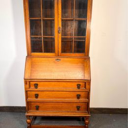 A Lovely Arts And Crafts Oak Bureau Bookcase with tooled leather writing area