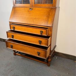 A Lovely Arts And Crafts Oak Bureau Bookcase with tooled leather writing area