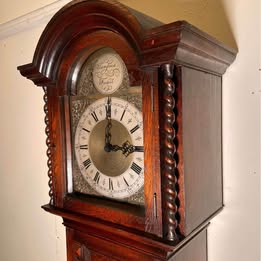 A Lovely Long Cased Tempus Fugit Oak Clock With Westminster Chime