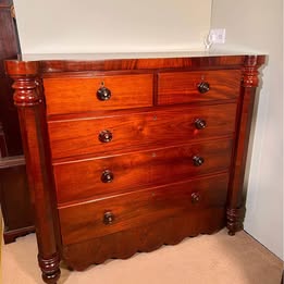 An Impressive Large Flame Mahogany Scotch Chest Flanked With Octagonal Columns