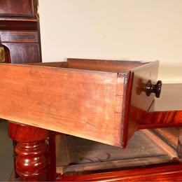 An Impressive Large Flame Mahogany Scotch Chest Flanked With Octagonal Columns