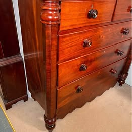 An Impressive Large Flame Mahogany Scotch Chest Flanked With Octagonal Columns