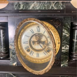 A Victorian Slate Mantel Clock With Green Italian Marble Inserts And Columns