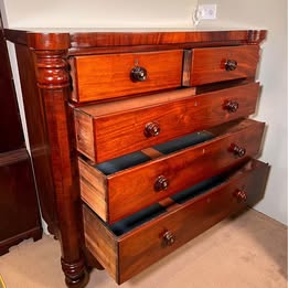 An Impressive Large Flame Mahogany Scotch Chest Flanked With Octagonal Columns