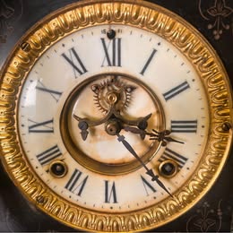 A Victorian Slate Mantel Clock With Green Italian Marble Inserts And Columns