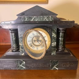 A Victorian Slate Mantel Clock With Green Italian Marble Inserts And Columns