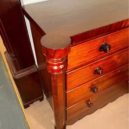 An Impressive Large Flame Mahogany Scotch Chest Flanked With Octagonal Columns