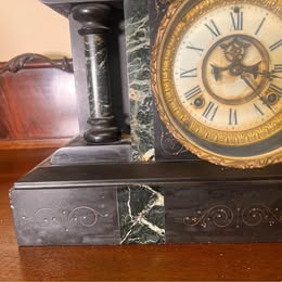 A Victorian Slate Mantel Clock With Green Italian Marble Inserts And Columns