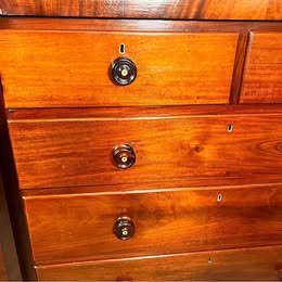 An Impressive Large Flame Mahogany Scotch Chest Flanked With Octagonal Columns