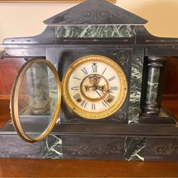 A Victorian Slate Mantel Clock With Green Italian Marble Inserts And Columns