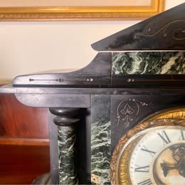 A Victorian Slate Mantel Clock With Green Italian Marble Inserts And Columns