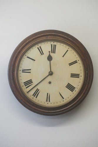 A handsome antique mahogany eight day school wallclock with a 12