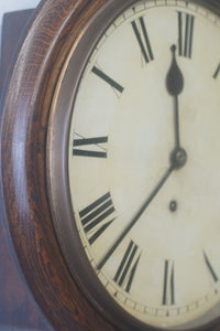 A handsome antique mahogany eight day school wallclock with a 12" clean white dial