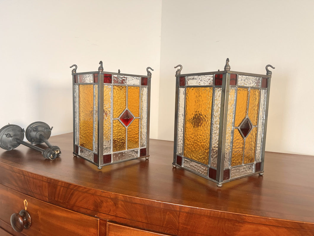 A Lovely Pair Of Leaded Glass Hanging Lights Within Unpolished Brass frames