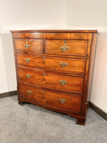 An Empire Bow Front Five Drawer Chest With Rope Turned Columns