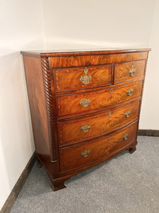An Empire Bow Front Five Drawer Chest With Rope Turned Columns