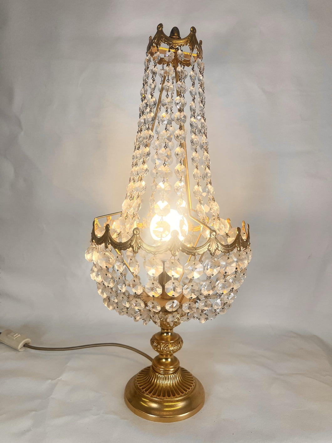 A Large Empire Style Table Lamp Made Of Chiselled Brass Covered With Octagonal Glass Chains
