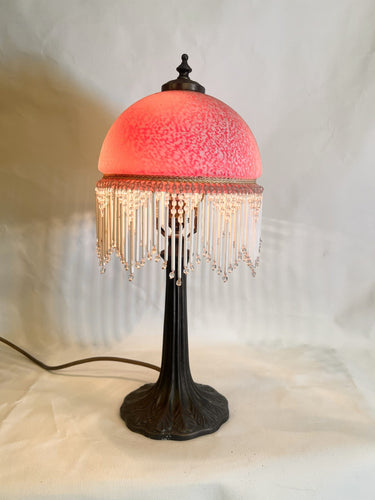 A Vintage Victorian Boudoir Lamp With A Frosted Glass Dome And Beaded Fringe