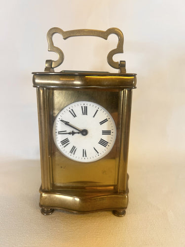 A Fully Glazed Classic Corniche Polished Brass Carriage Clock With A Fine White Enamel Dial