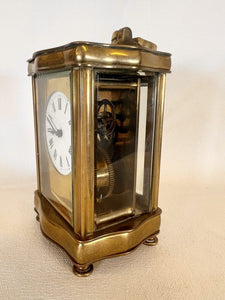 A Fully Glazed Classic Corniche Polished Brass Carriage Clock With A Fine White Enamel Dial