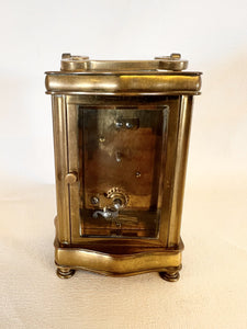 A Fully Glazed Classic Corniche Polished Brass Carriage Clock With A Fine White Enamel Dial