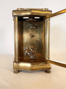 A Fully Glazed Classic Corniche Polished Brass Carriage Clock With A Fine White Enamel Dial