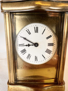 A Fully Glazed Classic Corniche Polished Brass Carriage Clock With A Fine White Enamel Dial