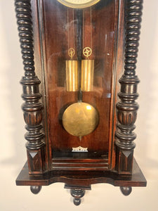 A 19th Century Walnut Cased Vienna Style Wall Clock With Twin Train Weight Driven Movement