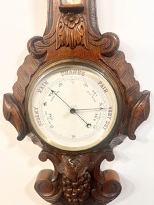 A Huge Edwardian Carved Oak Aneroid Barometer And Thermometer