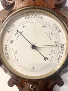 A Huge Edwardian Carved Oak Aneroid Barometer And Thermometer