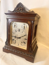 Load image into Gallery viewer, A Large Mahogany Mounted Striking Table Clock With Silvered Dial