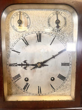 Load image into Gallery viewer, A Large Mahogany Mounted Striking Table Clock With Silvered Dial