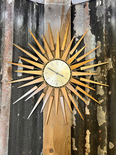 A Seth Thomas Sunburst Wall Clock Made From Teak With Gilt Metal