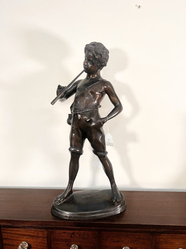 A Large Bronze Sculpture “Boy Playing The Flute” After The Work Of Sculpture Auguste Moreau (French, 1834-1917)