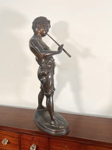 A Large Bronze Sculpture “Boy Playing The Flute” After The Work Of Sculpture Auguste Moreau (French, 1834-1917)