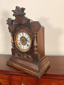 An Ansonia Twin Train Mantel Clock With A White Dial Chapter Ring