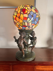 A Widdop Bingham And Co Bronze Figural Table Lamp With Tiffany Stained Glass Shade