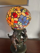Load image into Gallery viewer, A Widdop Bingham And Co Bronze Figural Table Lamp With Tiffany Stained Glass Shade
