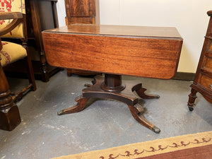 An Antique Single Pedestal Pembroke Table With Drawer