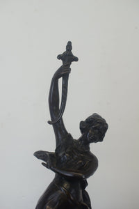 A graceful Victorian bronze statue of a beautiful girl holding a sword