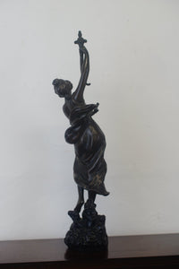 A graceful Victorian bronze statue of a beautiful girl holding a sword