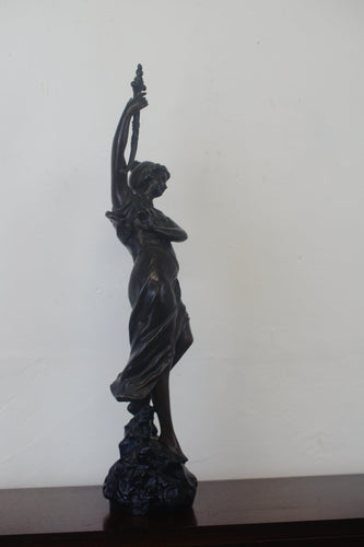 A graceful Victorian bronze statue of a beautiful girl holding a sword