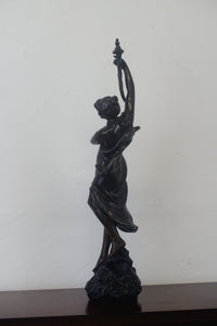 A graceful Victorian bronze statue of a beautiful girl holding a sword