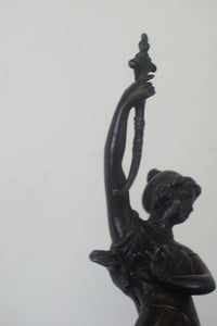 A graceful Victorian bronze statue of a beautiful girl holding a sword